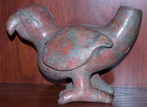 Colima parrot with a spout in its tail.  Red polished slip.  Toes on right foot
