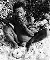 Oukwane eating a tsama melon (print is a cropped image)