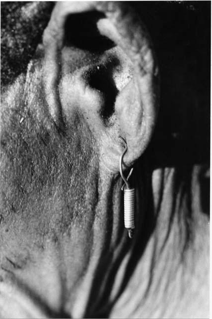 /Twikwe's left ear with earring, close-up