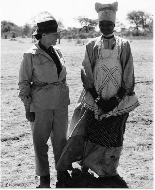 Lorna Marshall and the Herero woman standing together, full figure
