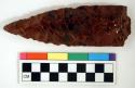 Chipped implement; chipped from red and black mottled obsidian