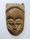Mask, carved wood, anthropomorphic facial features, polychrome paint