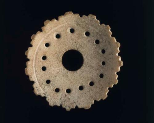 Perforated shell pectoral ornament