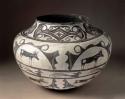 Polychrome pot in black, red, and white. Buck and deer designs in panels