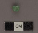 Tiny carved jadeite bead-like object - 7.8x5.8x4 mm.