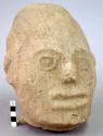 Life size head of human effigy in stone