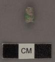Small decorated jadeite bead - 10x5.5x4 mm.