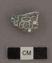 One jade fragment of ring or flare with hieroglyphs on reverse