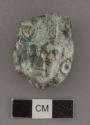One green, speckled and mottled with dark gray jade human head pendant. 1/4 roun