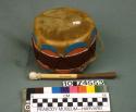 Small painted wooden drum (A) with beater (B)