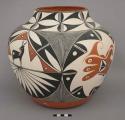 Polychrome olla with heartline deer, bird and feather motifs; electric-fired