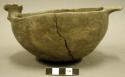 Ceramic complete effigy vessel, one handle, head is missing, plain bowl