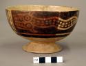 Pedestalled pottery bowl decorated with 2 double-headed serpents; negative paint