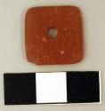 Square red stone pendant, perforated in center