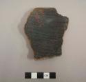 Rim sherd  from an outcurved bowl; flat base, flared rim, exterior slipped red,  interior smudged black, interior and exterior polishing stria - gila/salt smudged