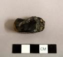 Flake, core fragment, one side of pebble removed by flaking; flaked obsidian