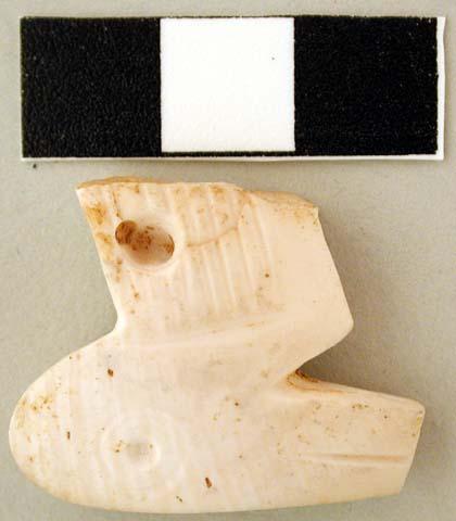 Carved shell pendant, bird form