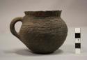 Complete vessel, cup with handle, etched pattern exterior