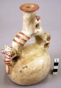 Pottery jar mouth in center of cross handle, animals on side, white