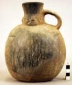 Pottery jar, handle on side, black, human form