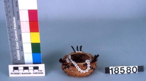 Small feathered, beaded basket - diameter of rim 1.75 in.