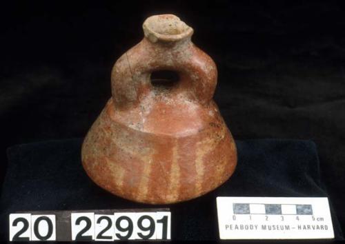 Coffee-colored clay vase with brace handle and spout