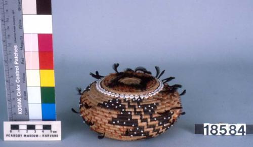 Feathered and beaded basket with cover