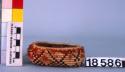 Small oval feathered basket--dimensions of rim 1.5 and 3 in.