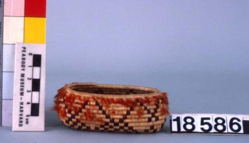 Small oval feathered basket--dimensions of rim 1.5 and 3 in.