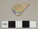 Blue transferprinted pearlware rim sherd to a bowl with a diameter of approximately 15 cm, decorations on interior only