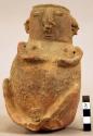 Terra cotta vase, grotesque human form