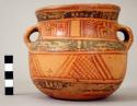 Two-handled Yojoa polychrome pottery bowl, bold anamalistic style.