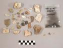 2 frags glass; 1 fragment pottery (?); 37 fragments quartz & quartz-like materia