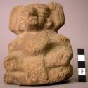 Ground stone sculpture, carved, seated human figure, carved arms, legs, torso, h