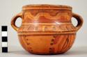 Two-handled Yojoa polychrome pottery pot, bold anamalistic style.