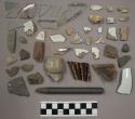 Chipping waste, brick, pottery, glass, charcoal, pottery sherds, biface fragment