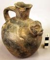 Black pottery jar, handle on side