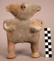 Crude pottery figure - 7 1/2" high; triangular shaped head with realistic nose;