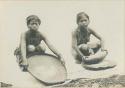 Tinguian women with winnowing basket and stone mill for grinding rice