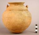 Large pottery jar with slight bulge belwo neck and two small modelled lugs