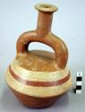 Pottery jar mouth in center of cross handle, painted, red
