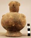 Terra cotta vase, grotesque human form