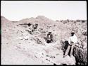 Hopi men excavating a trench, looking north, rooms 17-12