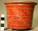 Pottery tripod vase with grooved geometrical decoration