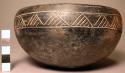 Hemispheric bowl, decorated with a grooved band of triangles with parallel lines
