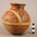 Pottery jar, red, with white band and black ornamentation