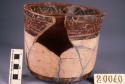 Polychrome pottery vessel - restored with part missing; 14 1/2 cm. high, 16cm. d