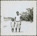Photograph album, Yaruro fieldwork, p. 12, photo 1, man and young girl posing for photograph