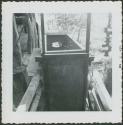 Photograph album, Yaruro fieldwork, p. 65, photo 5, unknown wooden object outdoors