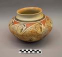 Polychrome-on-reddish brown jar: hatching and parrot motif